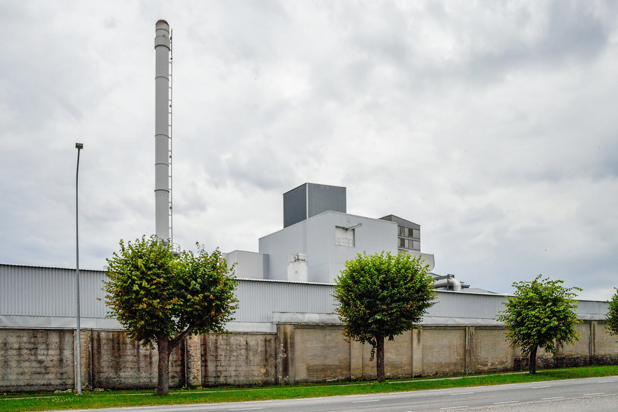 Industrial plant building under an overcast sky